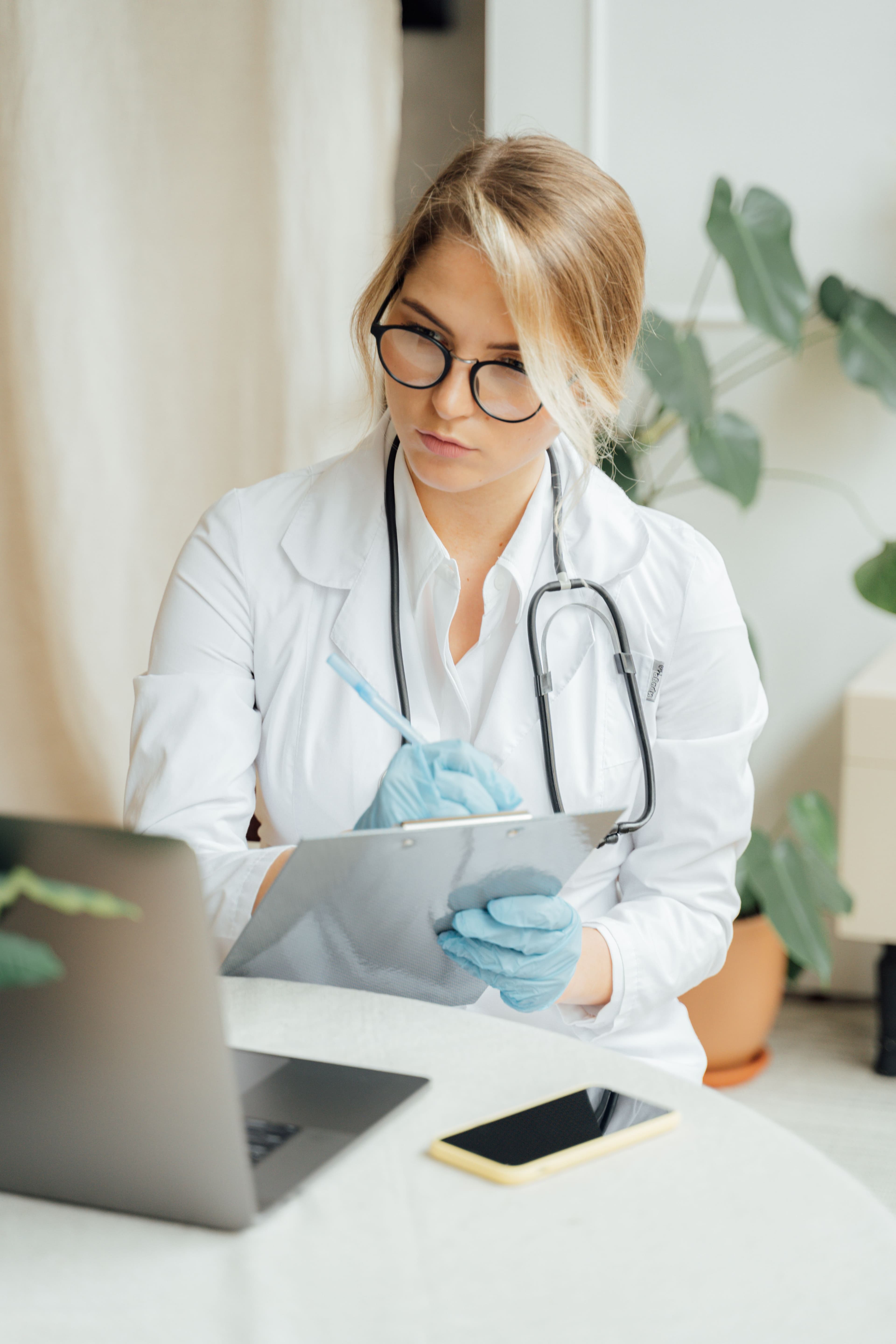 Woman reviewing lab results and hair health notes at her desk